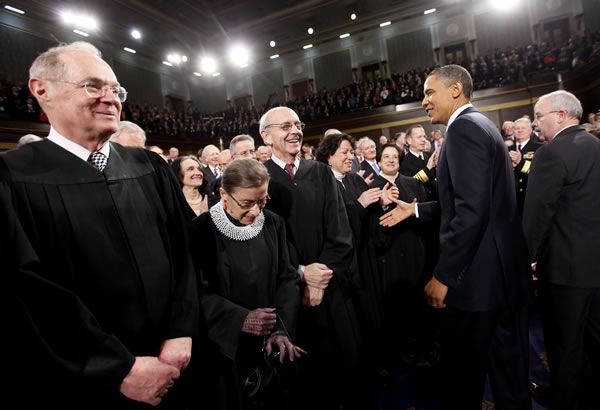 President Barack Obama greets Justice Sonia...