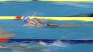 Swimmers train in the temporary pool at Rod Laver Arena at the World Swimming Championships in Melbourne, Australia, Thursday, March 22, 2007.