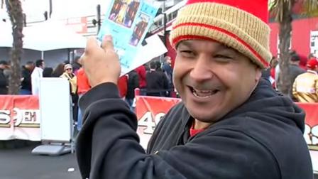 Excited 49er fan holds up Super Bowl tickets