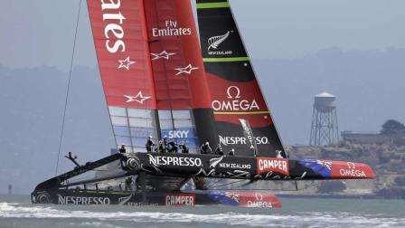 Emirates Team New Zealand races alone past Alcatraz Island during an Americas Cup challenger series sailing race Sunday, July 7, 2013, in San Francisco.