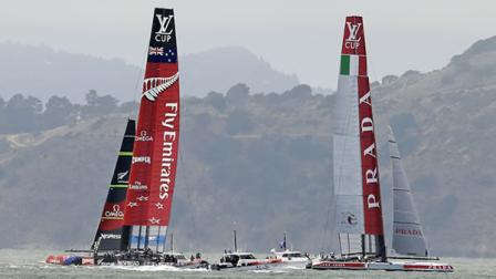 Emirates Team New Zealand, left, passes by Luna Rossa Challenge, right, of Italy, while training for the Americas Cup sailing event on Thursday, July 11, 2013, in San Francisco.