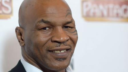 Mike Tyson arrives at the LA premiere of Mike Tyson: Undisputed Truth at the Pantages Theatre on Friday, March 8, 2013 in Los Angeles. (Photo by Richard Shotwell/Invision/AP)
