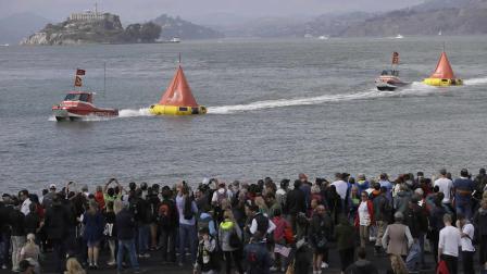 Boats to markers after the 14th race of the Americas Cup sailing event between Emirates Team New Zealand and Oracle Team USA was abandoned because of wind and postponed until Sunday, Saturday, Sept. 21, 2013, in San Francisco.