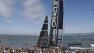 Spectators at Pier 27 cheer Oracle Team USA that won the 14th race of the Americas Cup sailing event against Emirates Team New Zealand, Sunday, Sept. 22, 2013, in San Francisco. (AP Photo/Eric Risberg)