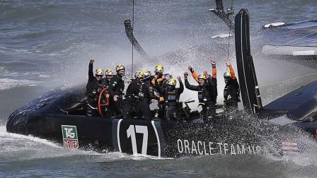 The crew on Oracle Team USA celebrates after winning the 19th race against Emirates Team New Zealand to win the Americas Cup sailing event, Wednesday, Sept. 25, 2013, in San Francisco. (AP Photo/Marcio Jose Sanchez)