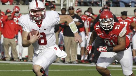 Stanford quarterback Kevin Hogan (8) carries the ball as Utah defensive tackle Tenny Palepoi (91) pursues during the first quarter of an NCAA college football game on Saturday, Oct. 12, 2013, in Salt Lake City. (AP Photo/Rick Bowmer)