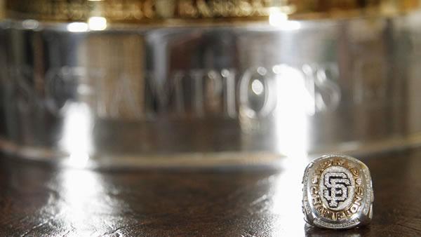 San Francisco Giants' 2010 World Series championship trophy and a championship ring is displayed in the East Room of the White House