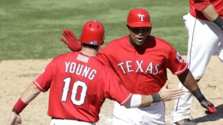 Texas Rangers Adrian Beltre, right, celebrates with Michael Young (10) following Beltres two-run home run off of Oakland Athletics Josh Outman
