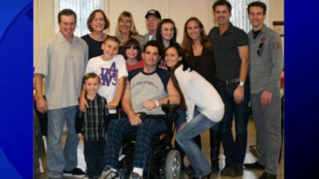 A Thanksgiving photo posted on his website shows Bryan Stow seated in a wheelchair surrounded by friends and family.