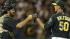 Oakland Athletics Grant Balfour, right, celebrates with catcher Derek Norris after the final out is made against the Kansas City Royals