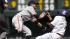 San Francisco Giants second baseman Nick Noonan, left, tries to field the throw as Colorado Rockies Eric Young steals second base in the first inning of the MLB National League baseball game in Denver on Sunday, May 19, 2013