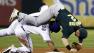 Oakland Athletics shortstop Cliff Pennington (2) is upended by Texas Rangers Mitch Moreland after Moreland was forced at second on a double play in the fourth inning of a baseball game, Wednesday, Sept. 26, 2012, in Arlington, Texas