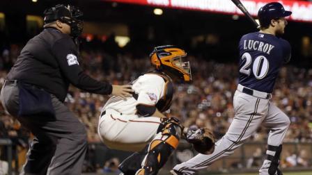 Milwaukee Brewers Jonathan Lucroy (20) drives in a run with a sacrifice fly against the San Francisco Giants during the ninth inning of a baseball game on Tuesday, Aug. 6, 2013, in San Francisco.