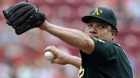 Oakland Athletics starting pitcher Bartolo Colon throws against the Cincinnati Reds