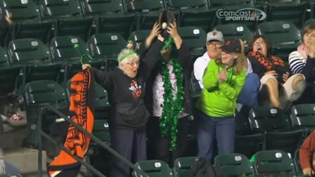 Longtime San Francisco Giants fan Virginia Smith catches a foul ball in the 9th inning.
