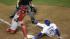 Los Angeles Dodgers Carl Crawford slides safely past St. Louis Cardinals catcher Yadier Molina