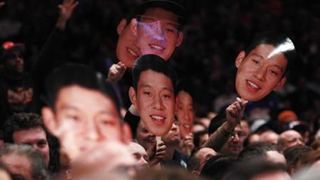 Fans hold up New York Knicks Jeremy Lin photos