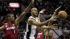 San Antonio Spurs Tony Parker (9) passes the ball against Miami Heats Chris Bosh (1) and Mario Chalmers (15) during the first half at Game 3 of the NBA Finals basketball series, Tuesday, June 11, 2013.