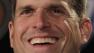 Jim Harbaugh smiles during a news conference Friday, Jan. 7, 2011, in San Francisco, introducing him as the new head coach of the San Francisco 49ers NFL football team.