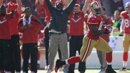 San Francisco 49ers tight end Vernon Davis (85) takes the ball into the endzone for a 49-yard touchdown against the New Orleans Saints.