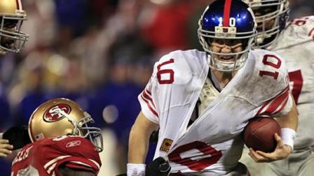 New York Giants quarterback Eli Manning is sacked by San Francisco 49ers Patrick Willis during the second half of the NFC Championship NFL football game Sunday, Jan. 22, 2012, in San Francisco. (AP Photo/Marcio Jose Sanchez)