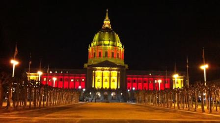 San Francisco City Hall lit up in red and gold in honor of the 49ers.