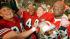 San Francisco 49ers quarterback Joe Montana raises his helmet toward the crowd as he leaves the field following the team's 55-10 victory over the Denver Broncos in the SuperBowl in New Orleans, La., Jan. 28, 1990.