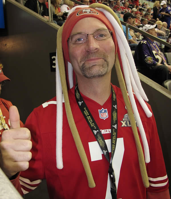 A 49ers fan gives a thumbs up.