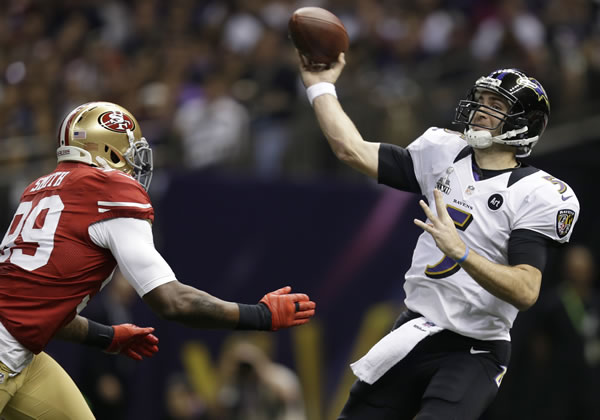 Baltimore Ravens quarterback Joe Flacco (5)...