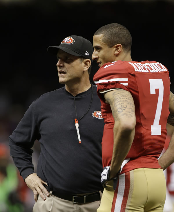 San Francisco 49ers head coach Jim Harbaugh and...