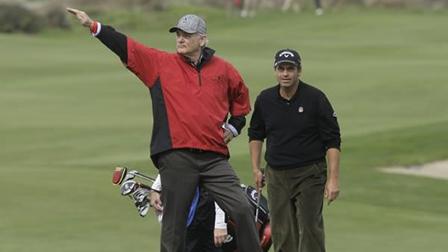 Actor Bill Murray gestures in front of Rocco Mediate.