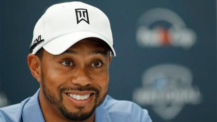 Tiger Woods smiles during a news conference at the AT&T National golf tournament at the Aronimink Golf Club Tuesday, June 28, 2011,