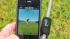 The SwingTip Ap on a smartphone, next to the...