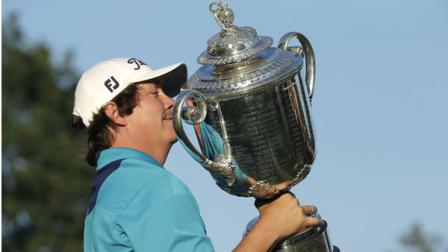Jason Dufner holds up the Wanamaker Trophy after winning the PGA Championship golf tournament at Oak Hill Country Club, Sunday, Aug. 11, 2013, in Pittsford, N.Y. (AP Photo/Charlie Riedel)