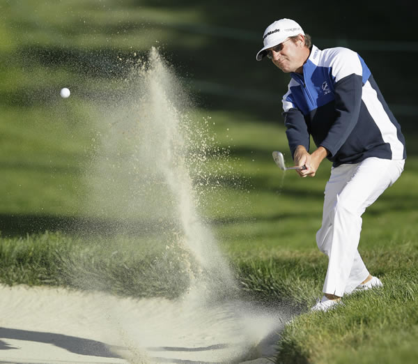 David Mathis hits out of a bunker on the 18th...