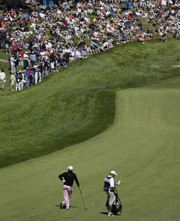 Graeme McDowell, of Northern Ireland, waits to...