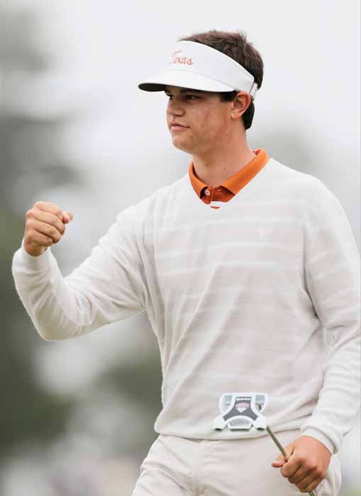 Amateur Beau Hossler reacts after chipping in to...