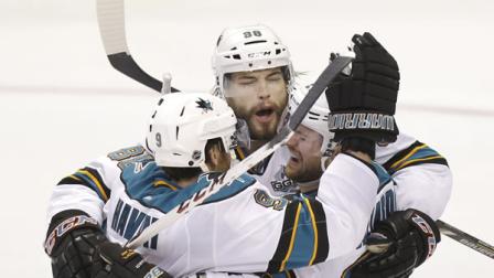 San Jose Sharks defenseman Brent Burns, center, celebrates his goal with teammates Martin Havlat (9) and T.J. Galiardi (21) during the third period of an NHL hockey game against the Dallas Stars Saturday, April 13, 2013, in Dallas. (AP Photo/LM Otero)
