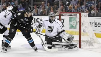 Los Angeles Kings goalie Jonathan Quick (32) blocks a goal attempt by San Jose Sharks center Logan Couture