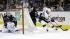 Los Angeles Kings right wing Justin Williams (14) tries to get around San Jose Sharks defenseman Justin Braun (61) as goalie Antti Niemi, of Finland, left, watches during the second period in Game 4.