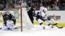 Los Angeles Kings right wing Justin Williams (14) tries to get around San Jose Sharks defenseman Justin Braun (61) as goalie Antti Niemi, of Finland, left, watches during the second period in Game 4.