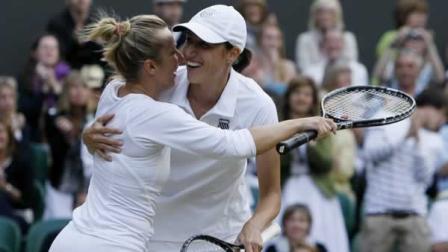 Kveta Peschke, left, of the Czech Republic and Slovenias Katarina Srebotnik celebrate after defeating Germanys Sabine Lisicki and Australias Samantha Stosur in the ladies doubles final against at the All England Lawn Tennis Championships at Wimbledon, Saturday, July 2, 2011.(AP Photo/Alastair Grant)