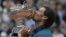 Spains Rafael Nadal kisses the trophy after winning against compatriot David Ferrer in three sets 6-3, 6-2, 6-3, in the final of the French Open tennis tournament