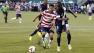 Belizes Elroy Smith and United States Chris Wondolowski in a soccer match
