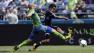 Seattle Sounders Osvaldo Alonso, left, defends as San Jose Earthquakes Rafael Baca attempts a shot in the first half of an MLS soccer match, Saturday, May 11, 2013, in Seattle