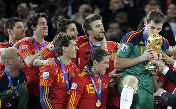 Spain goalkeeper Iker Casillas, right, kisses...