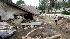 Henry Laguna walks around his property after a mudslide caused by heavy rains damaged his house in La Canada Flintridge, California.