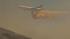 A Boeing Evergreen B-747 Supertanker drops fire retardant in Palmdale, Calif.