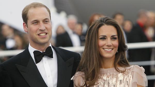 Britain's Prince William, left, and his wife Kate, Duchess of Cambridge, arrive at a charity event for Absolute Return for Kids, ARK, in central London.