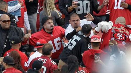 File - In this photo made Saturday, Aug. 20, 2011, football fans fight in the stands during a preseason NFL football game between the San Francisco 49ers and the Oakland Raiders in San Francisco.